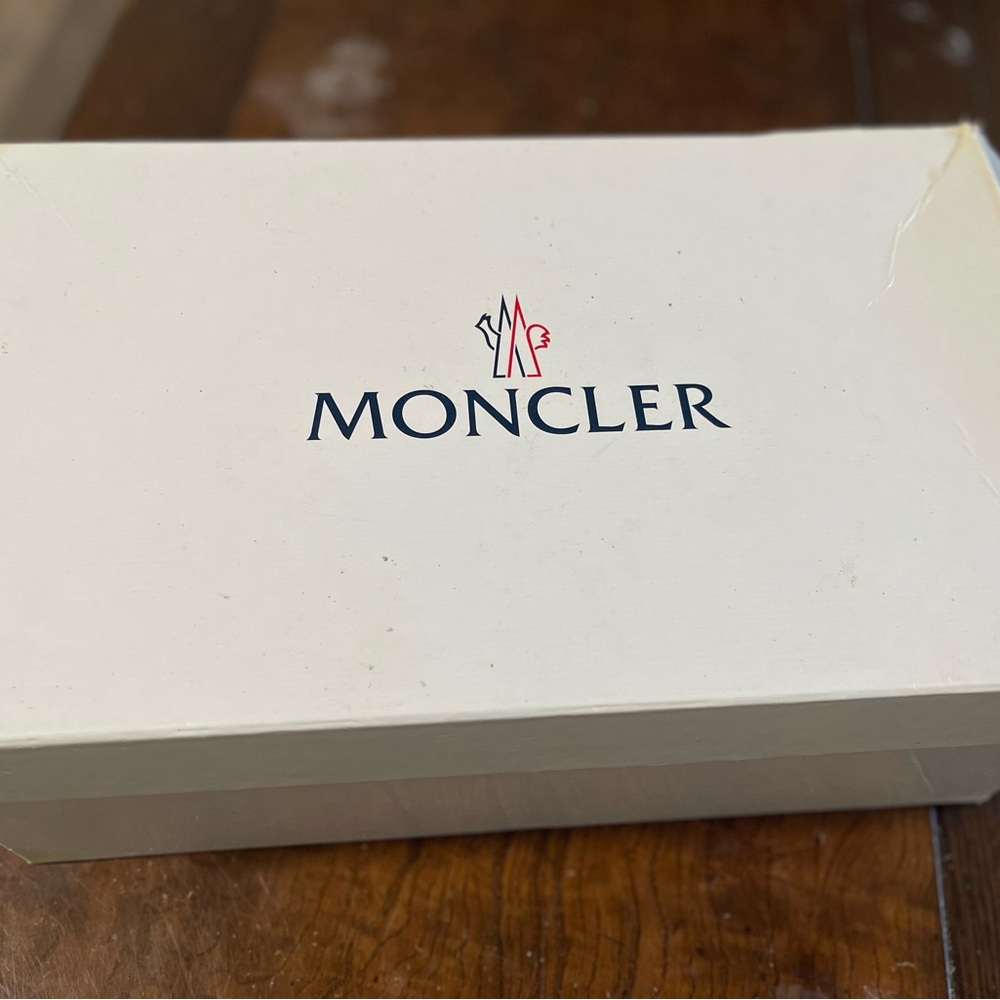 Hello I am selling a pair of black Moncler sneakers size 8